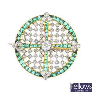 An Edwardian diamond and emerald brooch.
