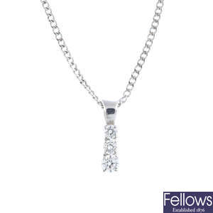A 9ct gold diamond three-stone pendant, with 9ct gold chain.