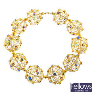 A sapphire, ruby, emerald and further gem-set collar.