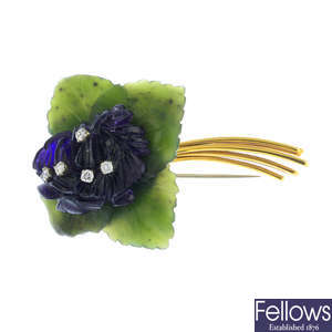 A diamond and gem-set floral brooch.