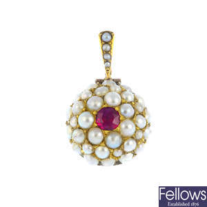 A ruby and split pearl pendant.