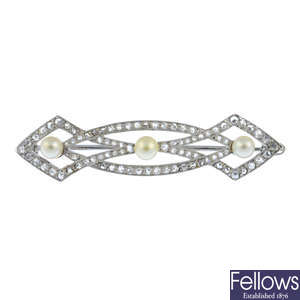 An early 20th century gold and platinum diamond and pearl brooch.