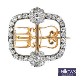 A late Victorian silver and gold diamond buckle brooch.