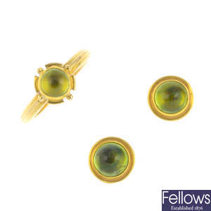 A set of peridot ring and a pair of earrings.