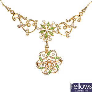 An Edwardian 15ct gold demantoid garnet and split pearl necklace, with detachable brooch/pendant.