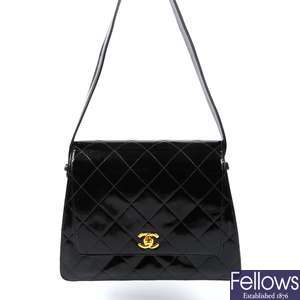 LOT:36  CHANEL - a Jumbo Caviar Classic Flap handbag.