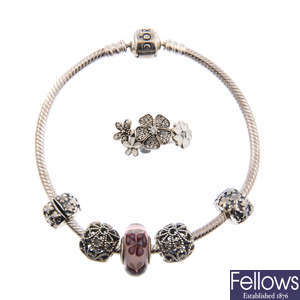 PANDORA - three bracelets, a ring and a loose charm.