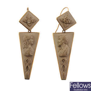 A pair of lava cameo earrings.