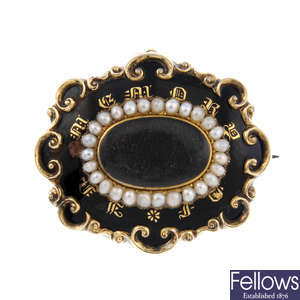 A late Victorian enamel and split pearl mourning brooch.