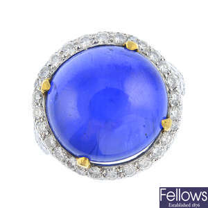 An 18ct gold Madagascan star sapphire and diamond cluster ring.