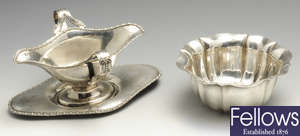 A late Victorian silver bowl & a 1920's silver sauce boat on stand. (2).