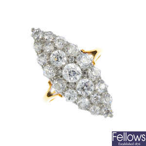 An early 20th century platinum and gold diamond cluster ring.