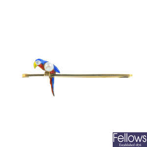 An early 20th century 15ct gold enamel and cultured pearl parrot brooch.