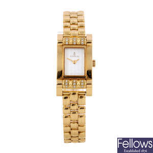 CORUM - a lady's 18ct yellow gold Tabogan bracelet watch.