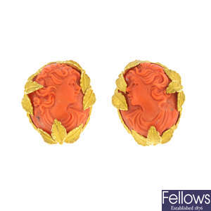A pair of coral cameo earrings.