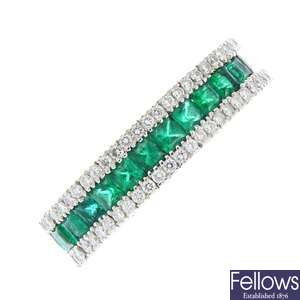 An 18ct gold emerald and diamond flexible ring.