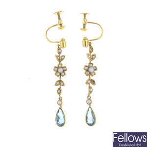 A pair of early 20th century gold aquamarine and split pearl earrings.