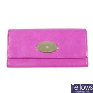 MULBERRY - a fuchsia Continental wallet.