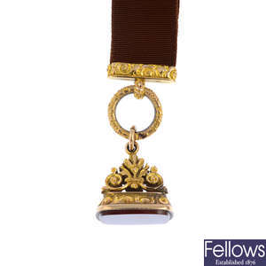A late Victorian gold carnelian fob, and moire Albertina.