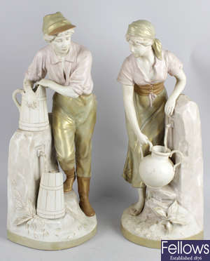 A pair of Royal Dux figurines.