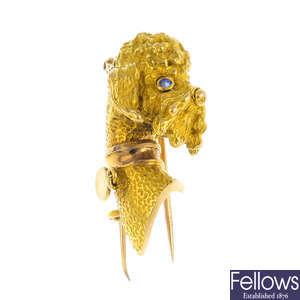 A 1960s gold sapphire dog brooch.