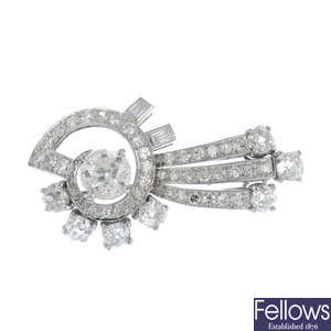 A 1940s gold diamond rosette brooch.