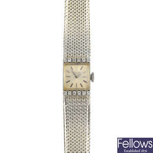 UNIVERSAL - a lady's mid 20th century diamond watch.