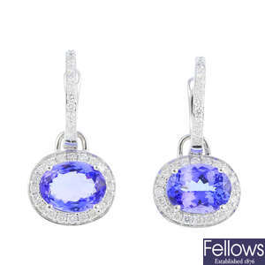 A pair of tanzanite and diamond earrings.