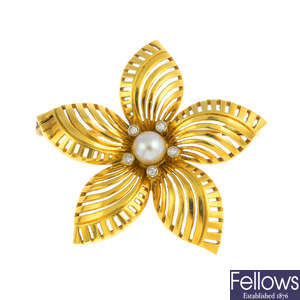 A cultured pearl and diamond flower brooch.