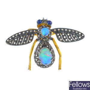 An opal and diamond bee brooch.