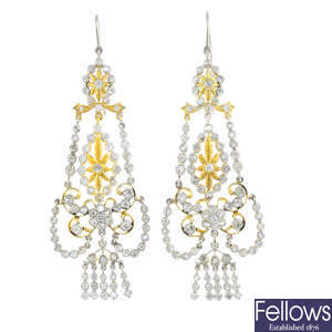 A pair of diamond chandelier earrings.