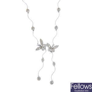 A diamond butterfly necklace. 