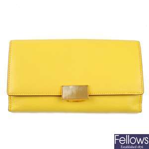 SMYTHSON - a pale yellow Continental wallet.