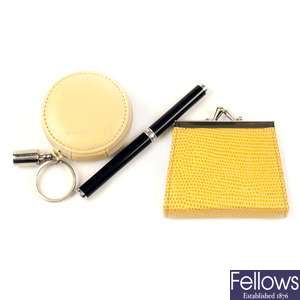 PENHALIGON'S - two miniature coin purses and a perfume pen.