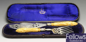 A pair of early Victorian silver and ivory handled fish servers.