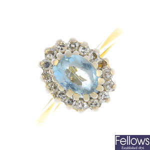 An 18ct gold aquamarine and diamond cluster ring. AF.