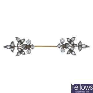 A late Victorian silver and gold, diamond jabot pin.