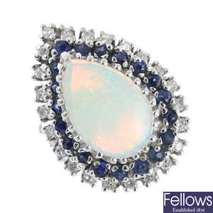 An opal, diamond and sapphire dress ring.
