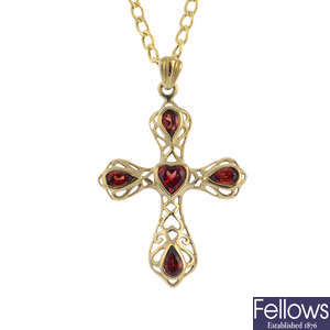 Two 9ct gold gem-set cross pendants, with 9ct gold chains.