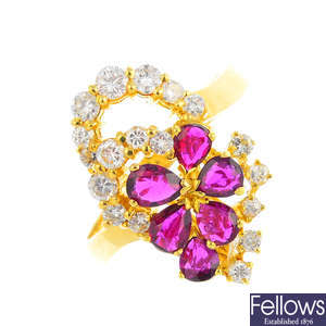 A ruby and diamond floral dress ring.