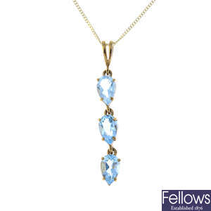 A 9ct gold blue topaz pendant, with chain and a pair of earrings.