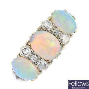 A gold opal and diamond ring.