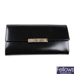 CARTIER - a black Love International leather wallet.