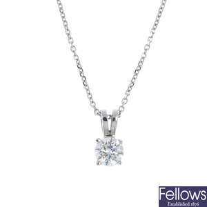 An 18ct gold diamond single-stone pendant, with chain.