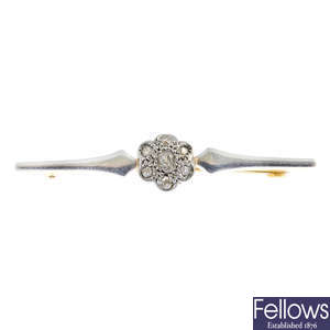 A mid 20th century platinum and 9ct gold diamond cluster bar brooch.