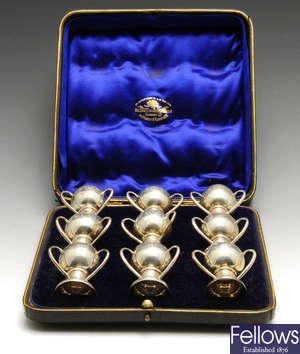 A cased set of nine Edwardian silver miniature 'tyg' shot cups.