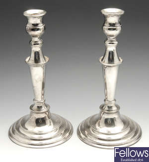 A modern pair of silver mounted candlesticks.