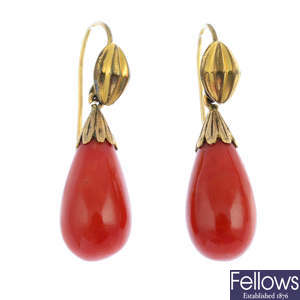 A pair of coral drop earrings.