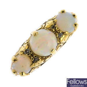 A mid 20th century 18ct gold opal three-stone ring.