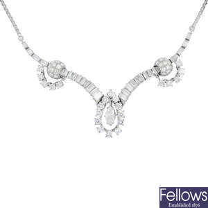 A mid 20th century diamond necklace, on 18ct gold chain.